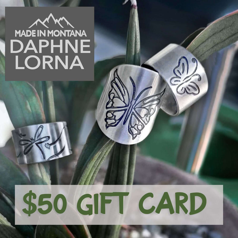 The dL Gift Card featuring $50 design with butterfly artwork and made in Montana branding.