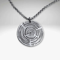 Timber Necklace featuring a circular pendant with concentric growth ring designs, available on adjustable chain or cord.