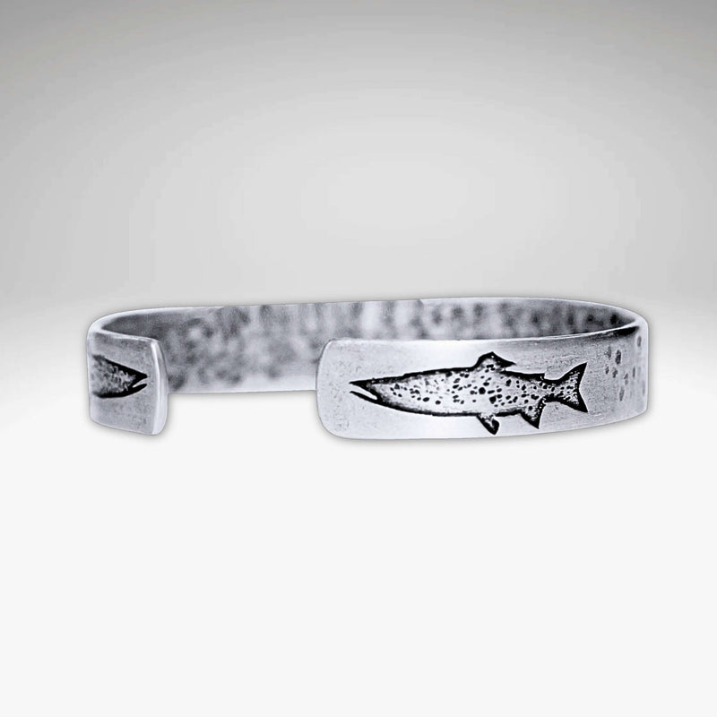 Trout on Tips Cuff Bracelet featuring an etched trout design, handmade and adjustable for both men and women.