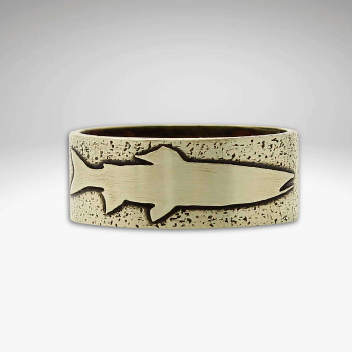 Handmade Trout Ring featuring an etched trout design on a textured background in raw brass.