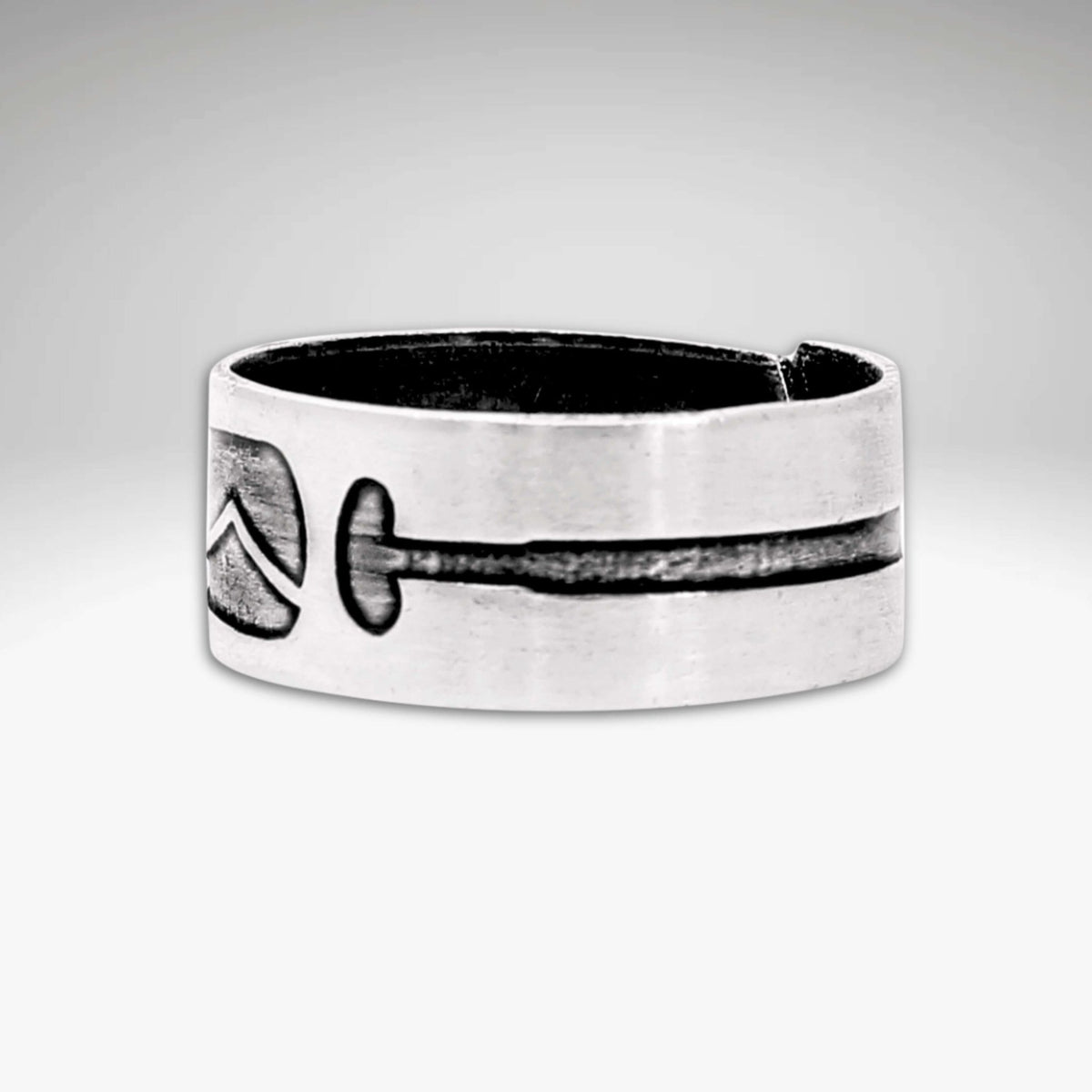 Upstream Adjustable Ring featuring a unique paddle design etched onto a raw brass adjustable ring.