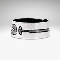 Upstream Adjustable Ring featuring a unique paddle design etched onto a raw brass adjustable ring.