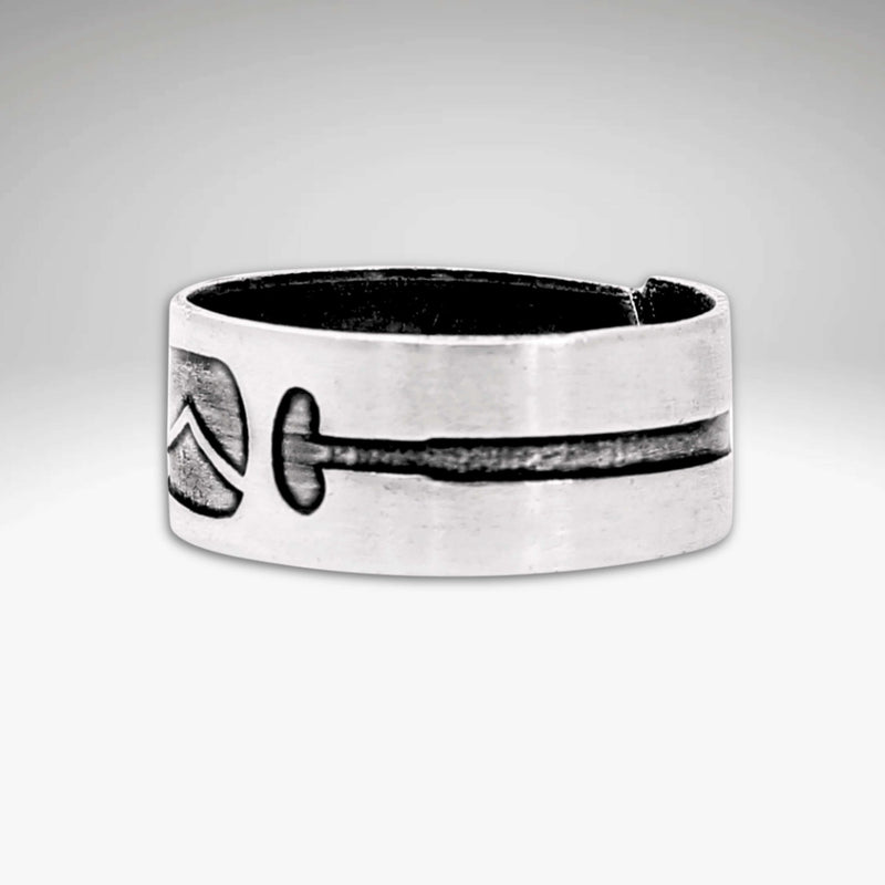 Upstream Adjustable Ring featuring a unique paddle design etched onto a raw brass adjustable ring.