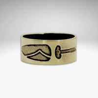 Upstream Adjustable Ring featuring a paddle design etched on raw brass, perfect for outdoor enthusiasts.