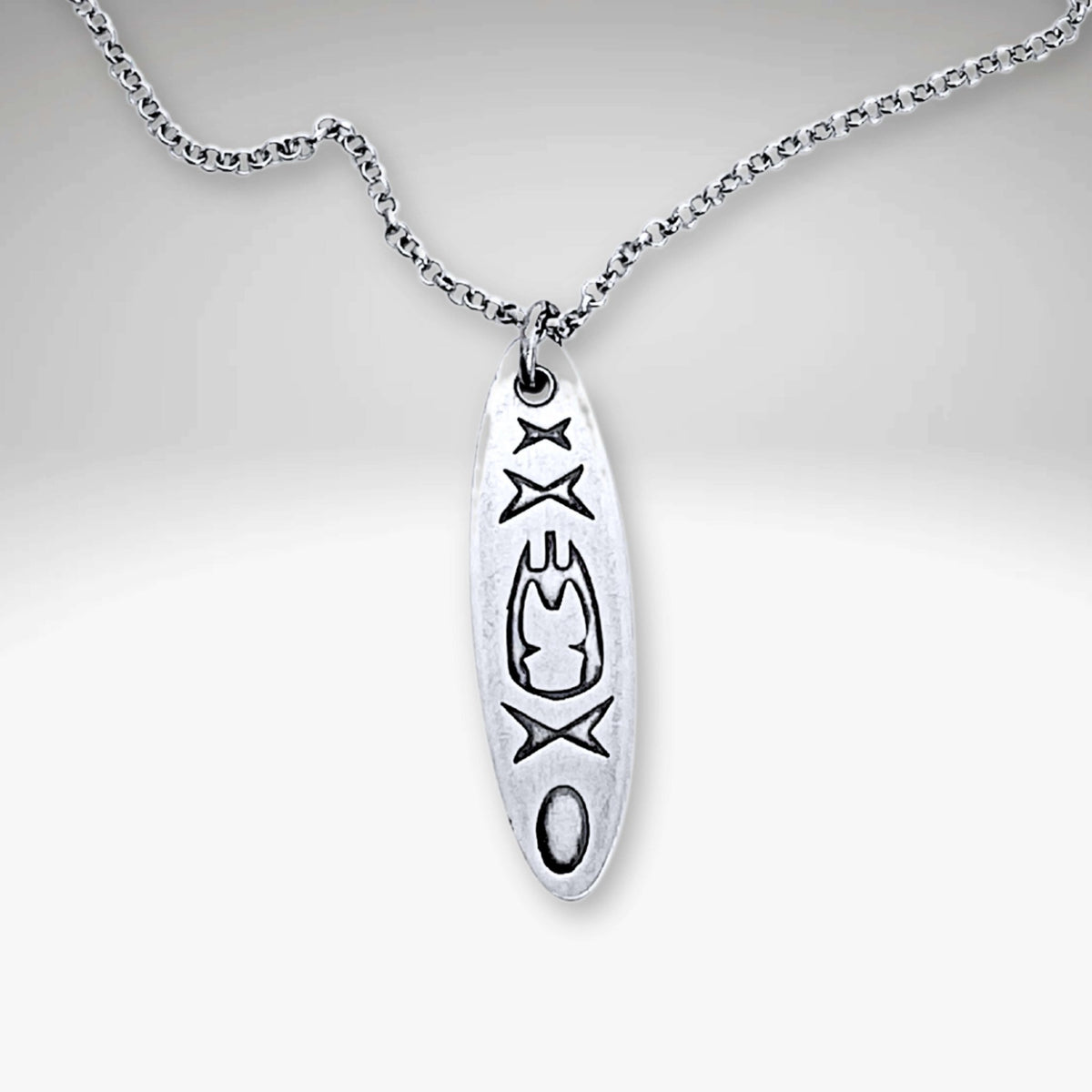 Upstream Necklace featuring a delicate kayak design on a silver rolo chain, adjustable from 16" to 18".