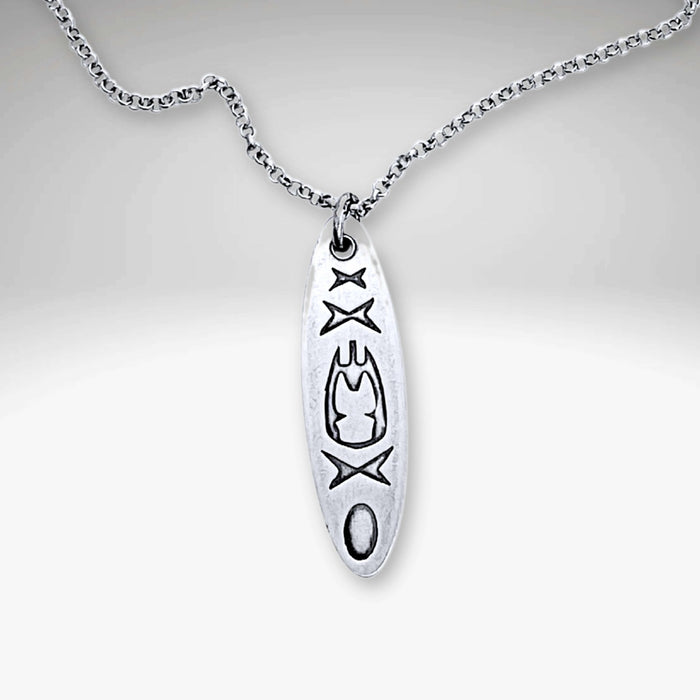 Upstream Necklace featuring a delicate kayak design on a silver rolo chain, adjustable from 16" to 18".