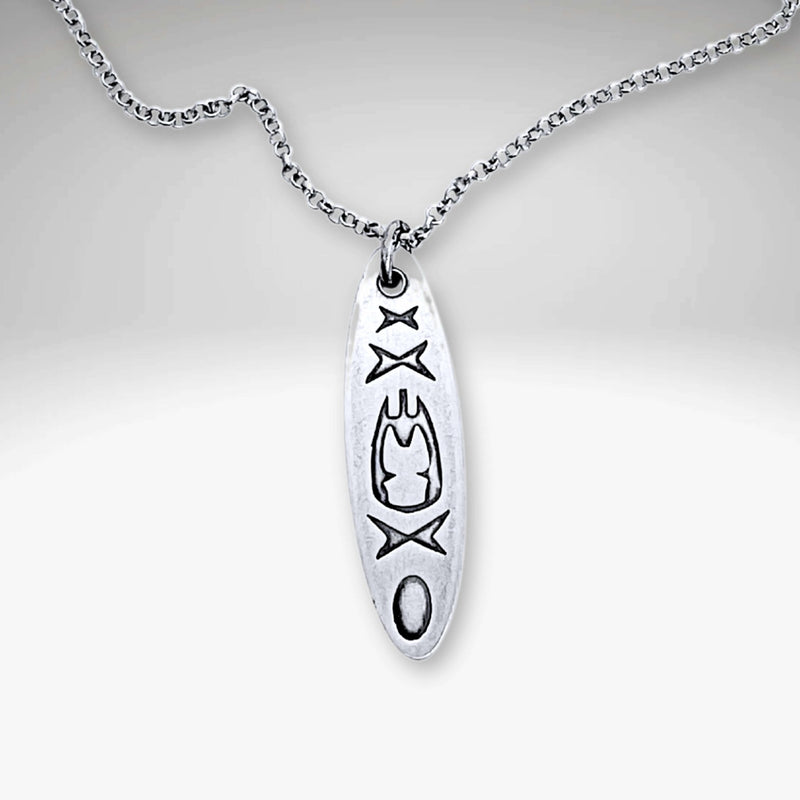 Upstream Necklace featuring a delicate kayak design on a silver rolo chain, adjustable from 16" to 18".