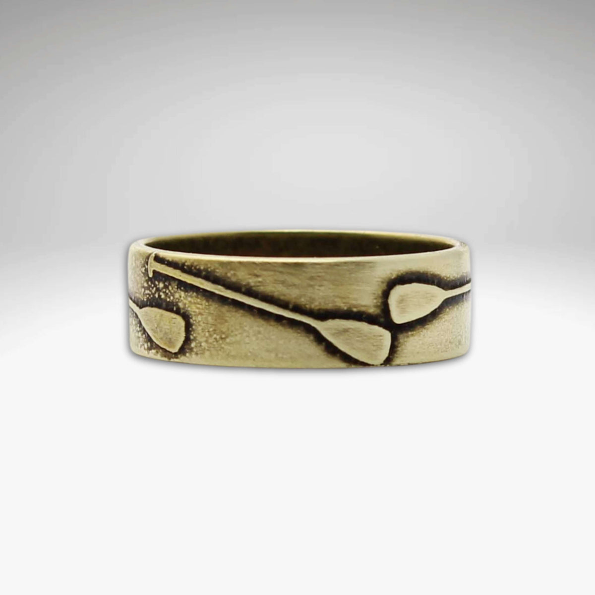 Upstream Paddle Ring featuring engraved paddles, perfect for water lovers and outdoor enthusiasts.