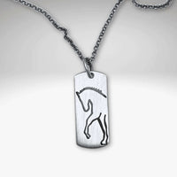 White Horse Necklace featuring a stunning silver silhouette of a horse on a dainty chain.