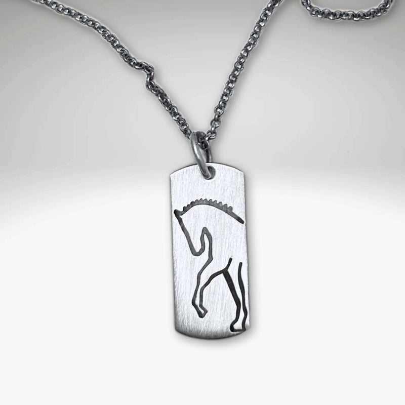 White Horse Necklace featuring a stunning silver silhouette of a horse on a dainty chain.