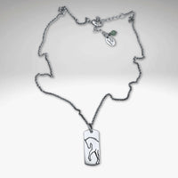 Elegant White Horse Necklace with a brass pendant and dainty chain, showcasing a graceful horse silhouette.