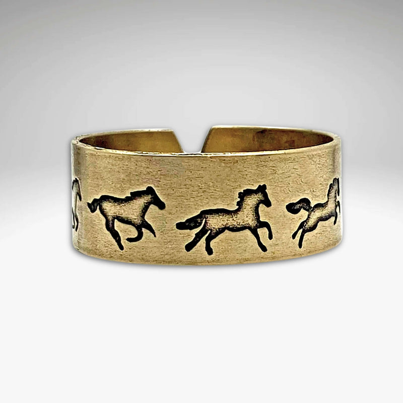 Wild Horses Adjustable Ring featuring galloping mustangs in antique brass finish.