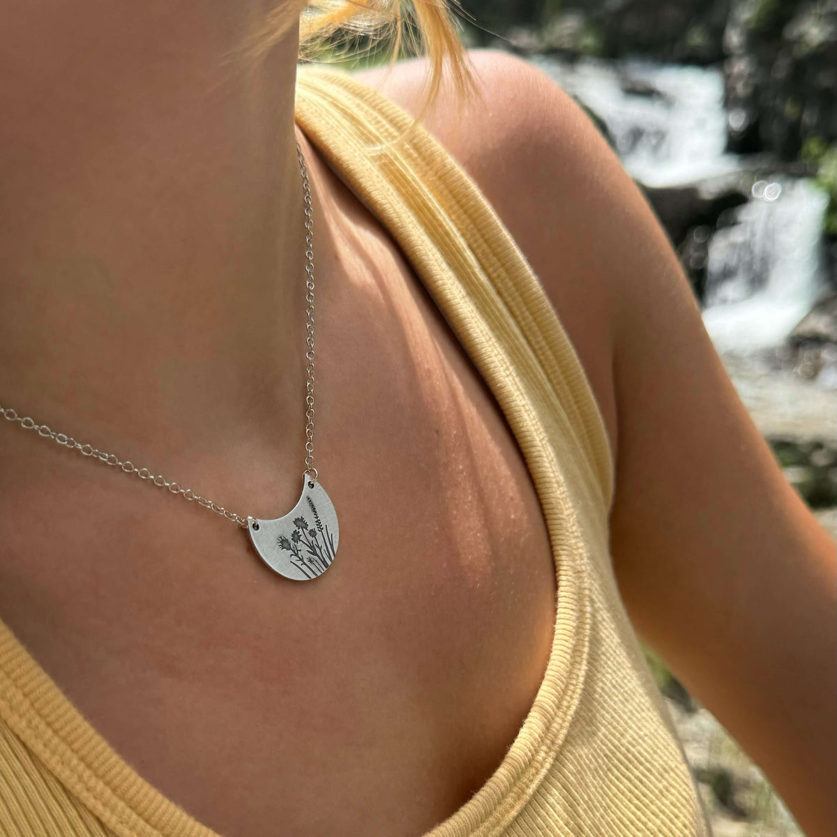 Wildflower Basket Necklace featured on a model, emphasizing floral design and elegant style, perfect for spring and summer.