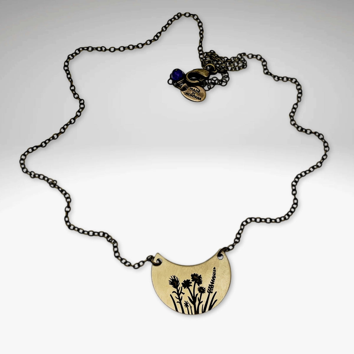 Wildflower Basket Necklace featuring intricate wildflower designs on a stylish chain.