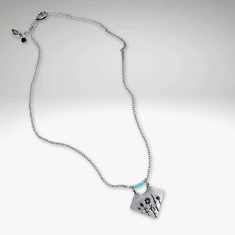 Wildflower Box Necklace featuring Indian Paintbrush and Wild Lupine with a matte silver finish and colored stones.