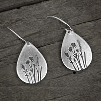 Wildflower Earrings crafted with a floral design featuring Indian Paintbrush and Wild Lupine on a rustic background.