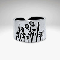 Wildflowers Adjustable Ring featuring engraved designs of wildflowers in silver.