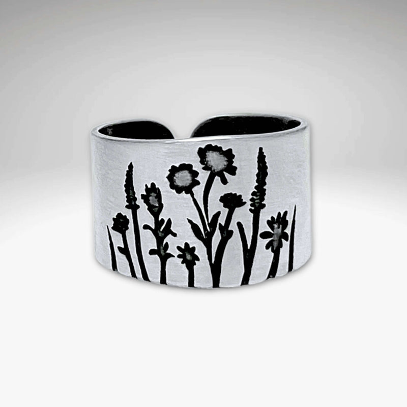 Wildflowers Adjustable Ring featuring engraved designs of wildflowers in silver.
