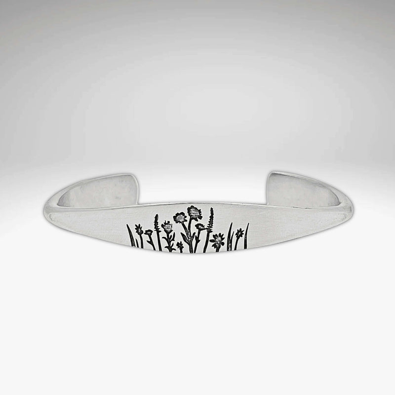Wildflowers Signet Cuff featuring intricately engraved wildflowers design on a sleek silver cuff bracelet.
