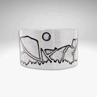 Yosemite Adjustable Ring showcasing iconic mountain landscape and sun design in a sleek silver finish.