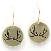 Antler Earrings featuring etched antlers on solid brass discs, hung from sterling silver earwire. Primal yet elegant design.