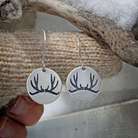 Elegant Antler Earrings etched in solid brass, hung from sterling silver wire, capturing the essence of the wild.