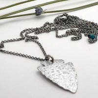 Arrowhead Long Layered Necklace featuring a hammered silver pendant on a silver chain.