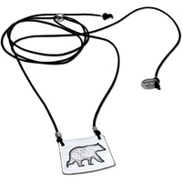 Bear Boy Necklace with bear silhouette on adjustable cord, perfect for outdoor enthusiasts.