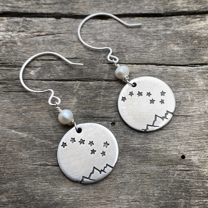 Big Dipper Earrings featuring etched stars and mountains, hanging from sterling silver earwires with freshwater pearl bead.