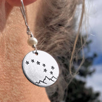 Big Dipper Earrings featuring etched stars over mountains, hanging from sterling silver earwire with a freshwater pearl bead.