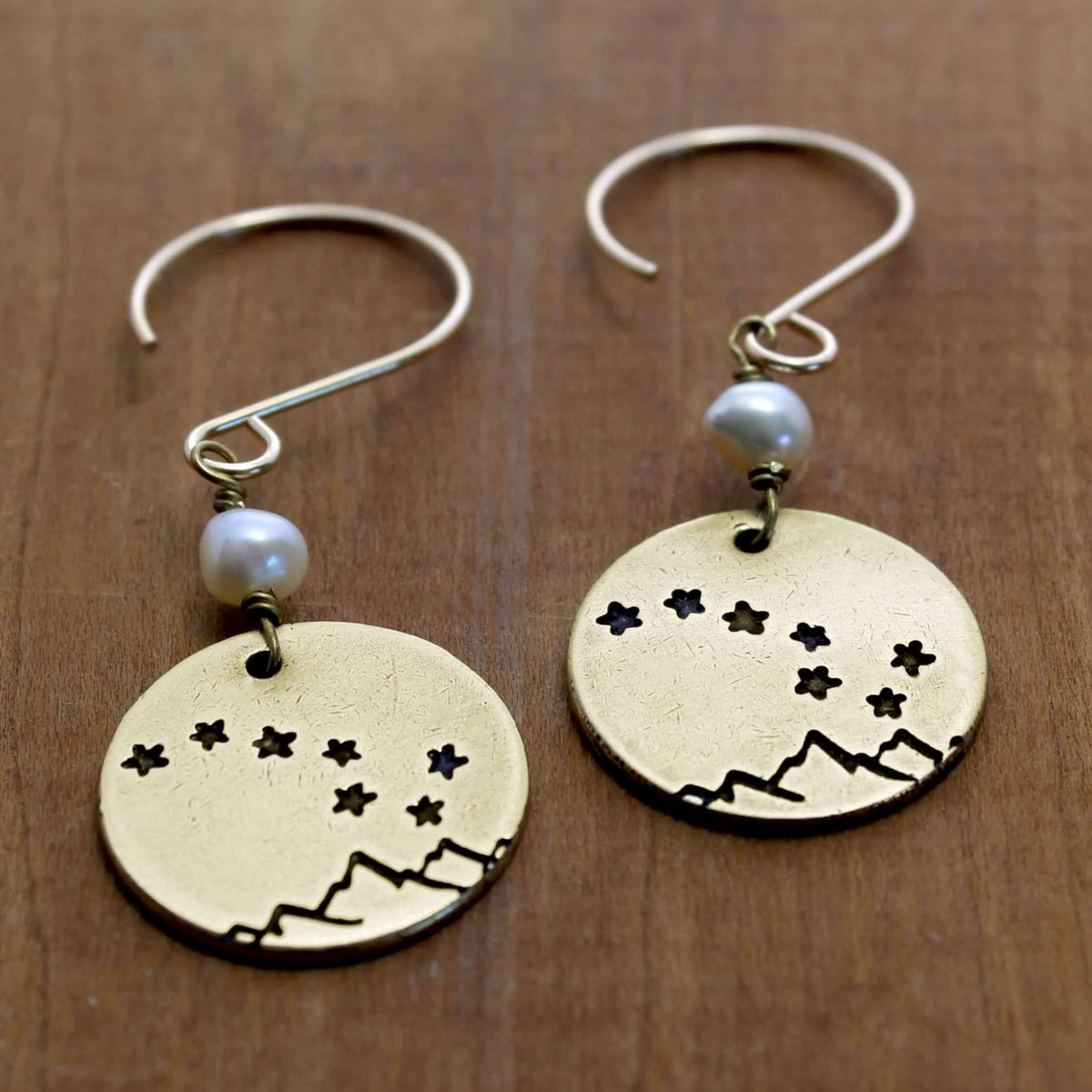 Big Dipper Earrings featuring etched design of stars and mountains with freshwater pearl accents on gold earwires.