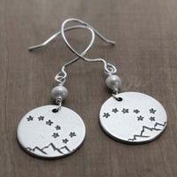 Big Dipper Earrings featuring etched stars and mountains on silver discs with freshwater pearl beads.
