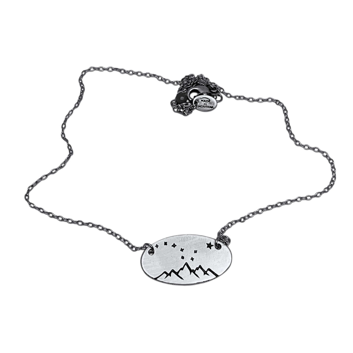 Big Dipper Necklace featuring etched stars on a silver chain, capturing the essence of the night sky.