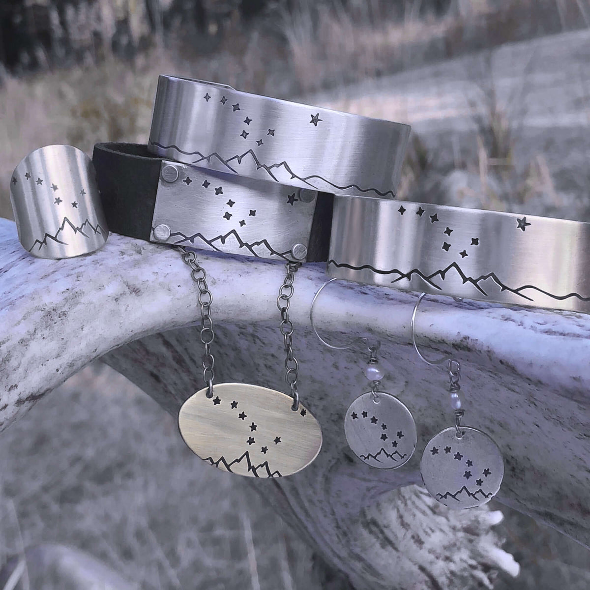 Big Dipper Ring collection featuring silver star-studded bracelets, necklace, and earrings showcasing the night sky.