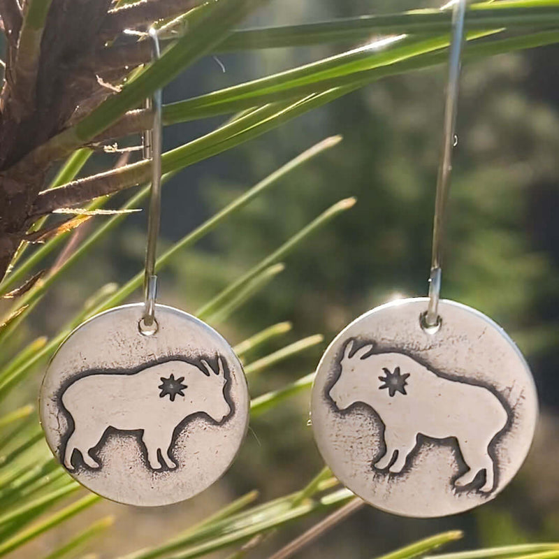 Billy Goat Earrings featuring a tiny star design, hanging from sterling silver earwires.