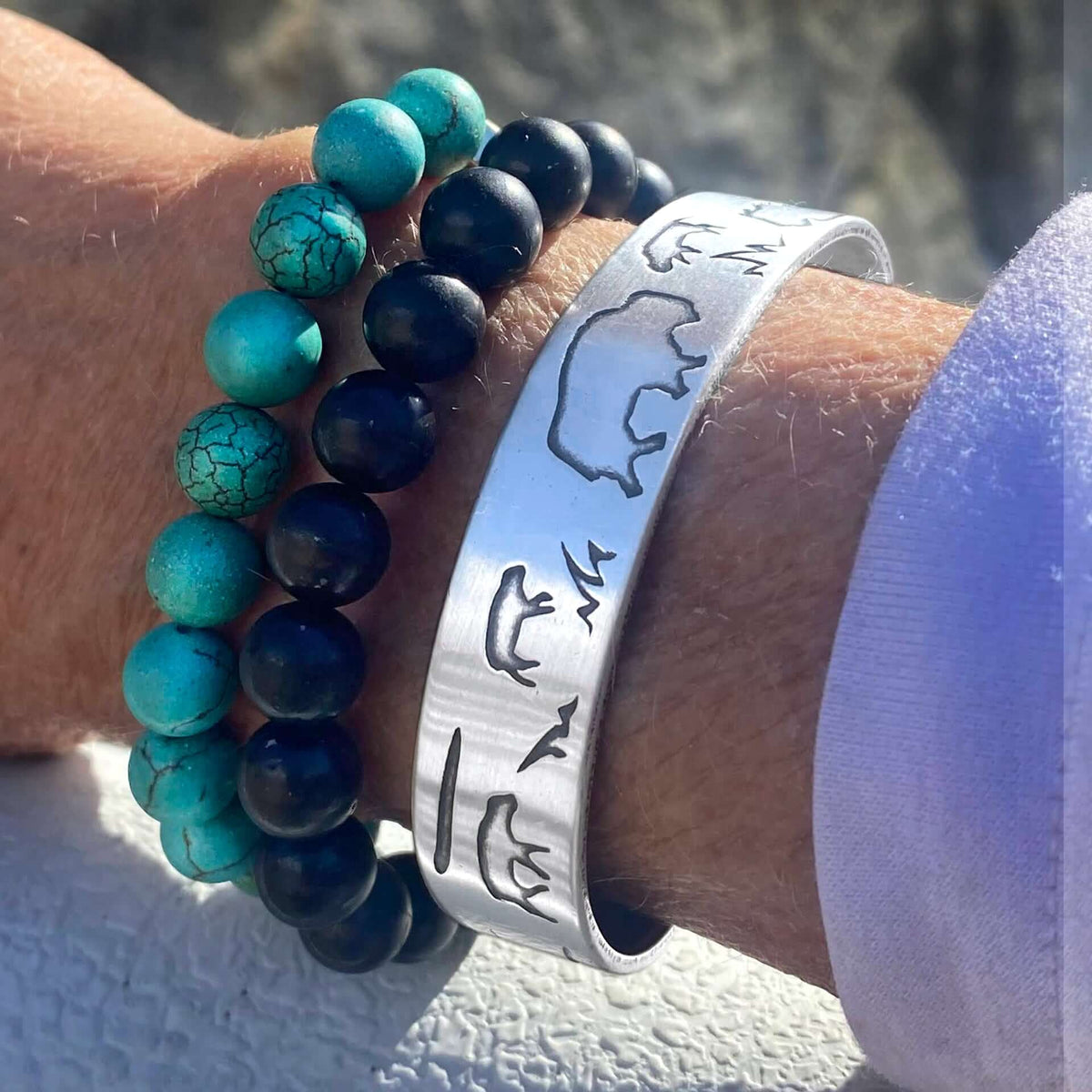 Buff and Babes Cuff Bracelet worn alongside beaded bracelets, showcasing unique animal design and adjustable fit.