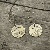 Buffalo in the Tetons Earring featuring etched buffalo and mountains on solid brass with a reflective design.