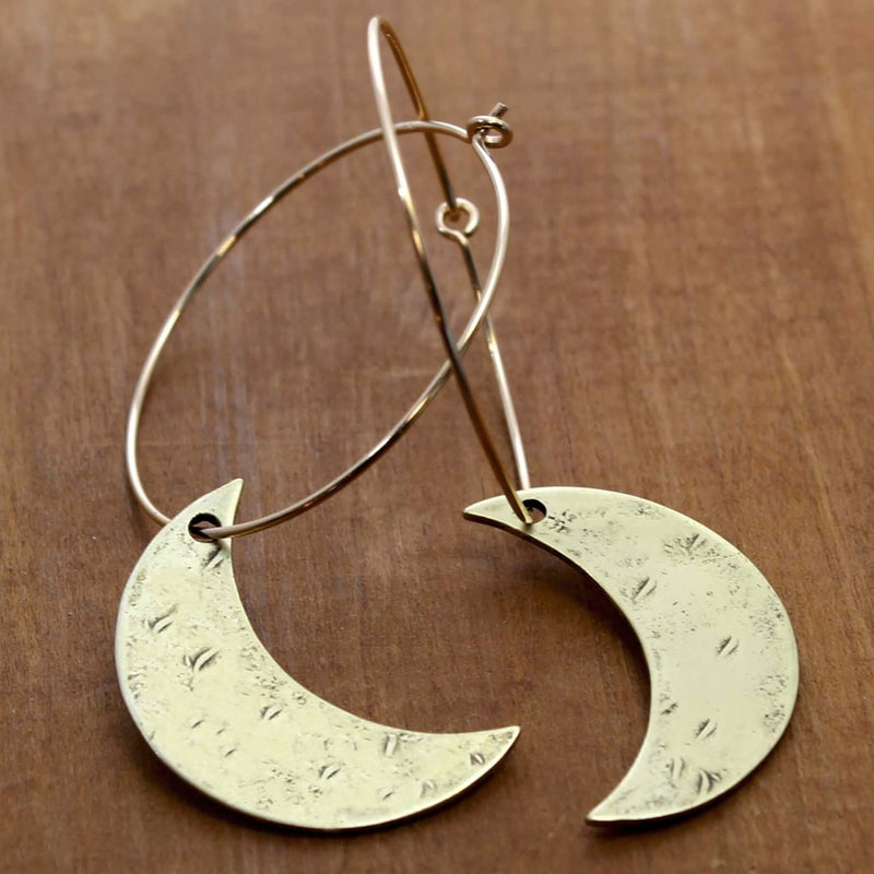 Crescent Moon Hoop Earrings featuring hammered solid brass moons on sterling silver hoops.