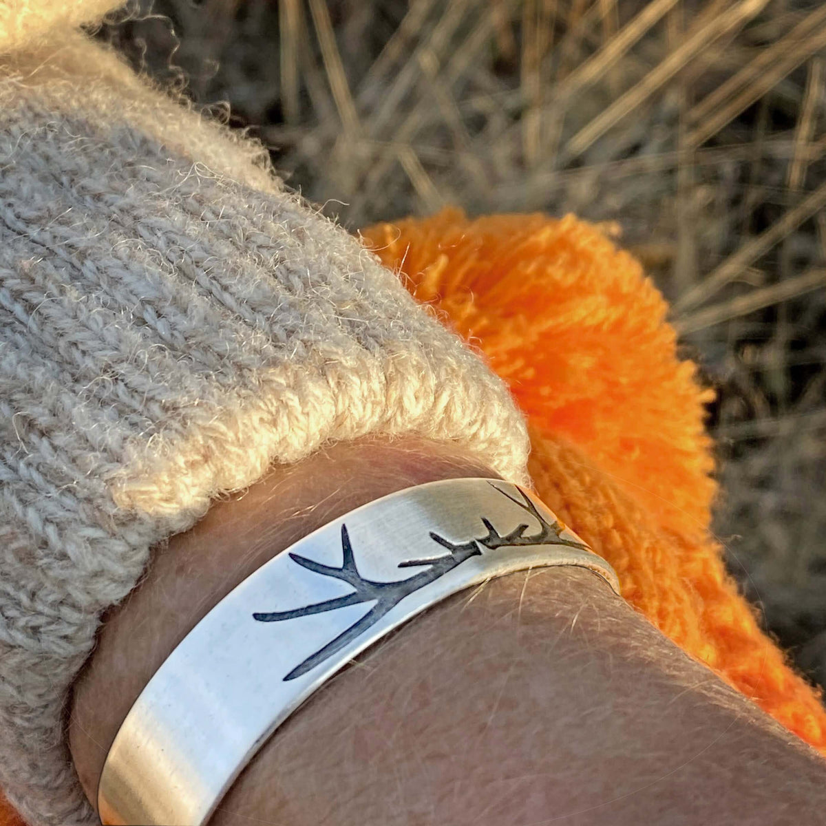 Elk Antlers Cuff Bracelet worn on wrist showcasing subtle elk antler etchings in Matte Silver finish.
