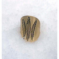 Feather Adjustable Ring featuring a three-feather design on a snowy background, perfect for nature lovers.