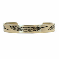 Feather Cuff Bracelet in Antique Brass finish showcasing feather engravings, adjustable cuff for bird watching and outdoor activities.