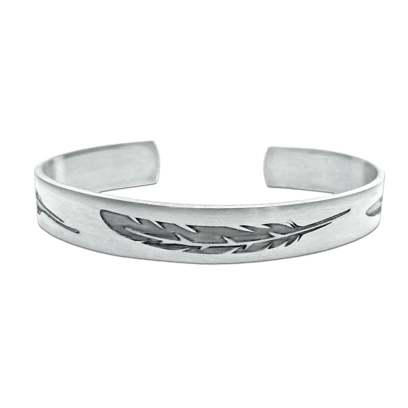 Feather Cuff Bracelet in matte silver showcasing intricate feather designs, perfect for outdoor activities.