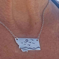 Flyover Montana - Necklace with Mountains birds and sun showcasing a serene Montana landscape.