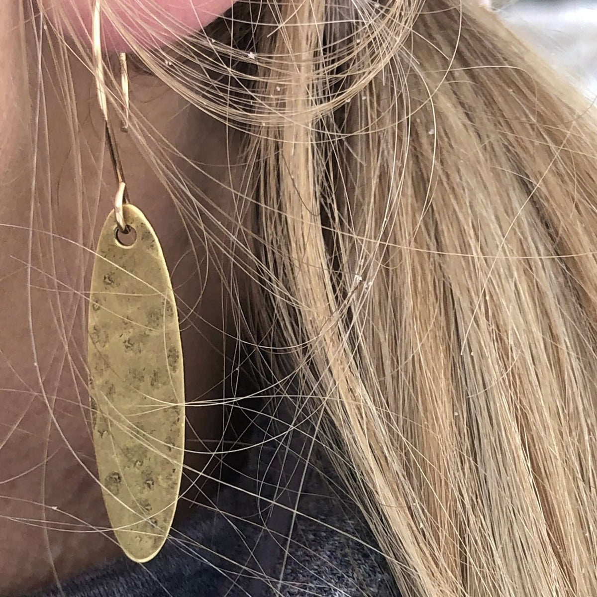 Fog Drop Earrings featuring raw brass with texture, hanging from gold filled earwire, perfect for a mysterious style.