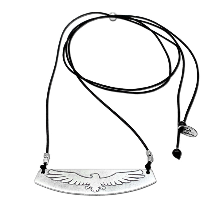 Freebird Necklace featuring a solid brass pendant with eagle design on an adjustable cord.