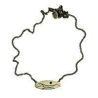 Glacier View Necklace in antique brass, featuring a mountain pendant and adjustable chain from 16" to 18".