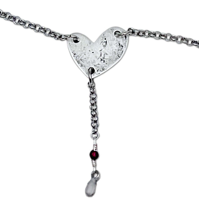 Heart Throb Y Necklace with heart pendant, silver chain, and decorative beads, symbolizing love and connection.