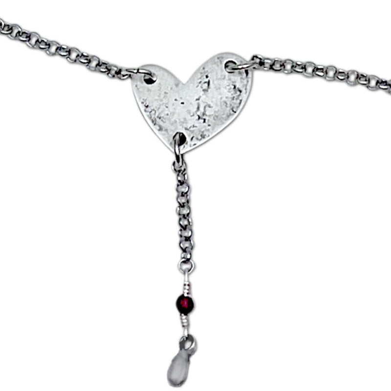 Heart Throb Y Necklace with heart pendant, silver chain, and decorative beads, symbolizing love and connection.