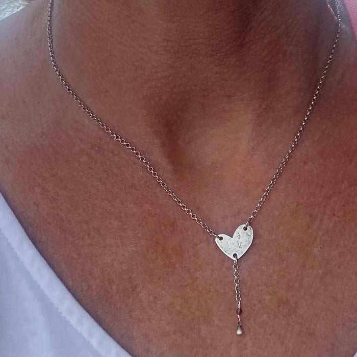 Heart Throb Y Necklace showcased on a model's neck, symbolizing love and cherished memories.