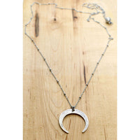 Horned Moon Necklace on satellite chain featuring a silver moon pendant and layered design.